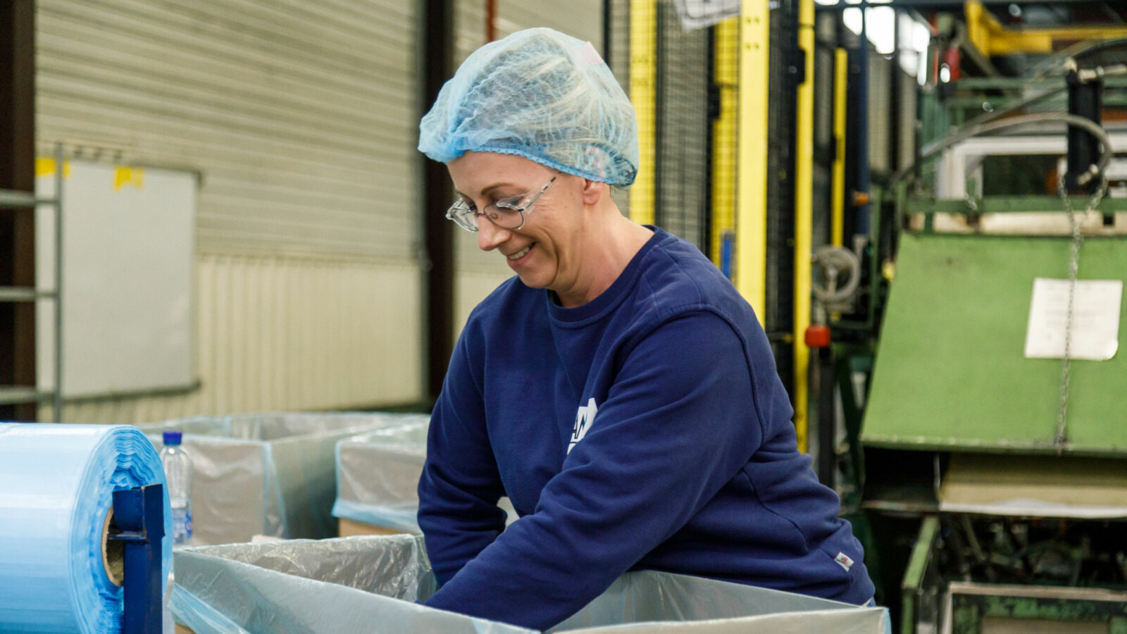 woman laughing while working